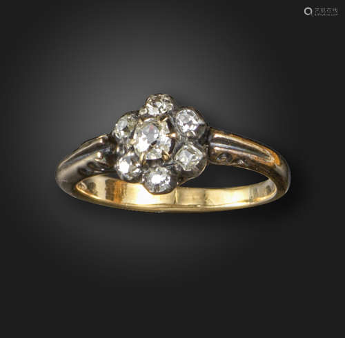 A Victorian diamond cluster ring, set with graduated old cushion-shaped diamonds in silver and