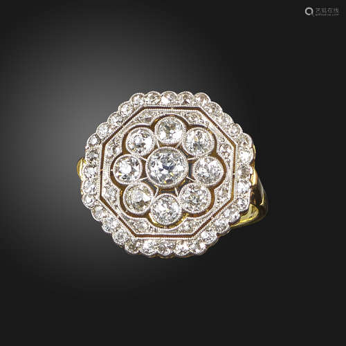 A diamond cluster ring, the octagonal-shaped plaque with pierced decoration, millegrain-set with