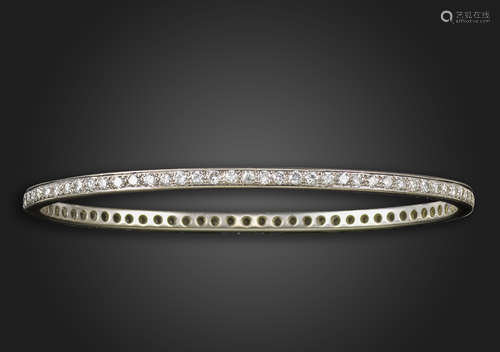 A diamond bangle, set overall with round brilliant-cut diamonds in white gold, diamonds