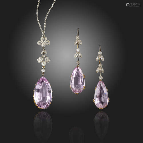 An Edwardian pink topaz and diamond pendant and earrings, the pear-shaped pink topaz suspends from