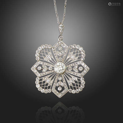 An Edwardian diamond pendant, of quatrefoil design, centred with an old circular-cut diamond