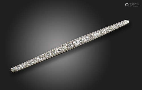 An early 20th century diamond bar brooch, set with graduated old circular-cut diamonds in