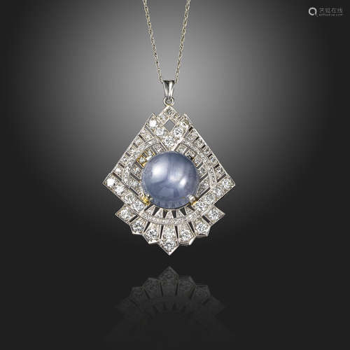 A star sapphire and diamond pendant, of geometric form, centred with a circular star sapphire