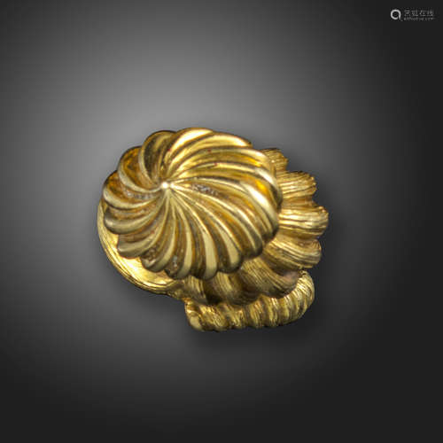 An abstract gold ring, designed as a swirl in textured yellow gold, size K approximately