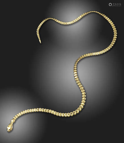 A gold 'Snake Necklace' by Elsa Peretti for Tiffany & Co., with a serpent's head clasp and graduated