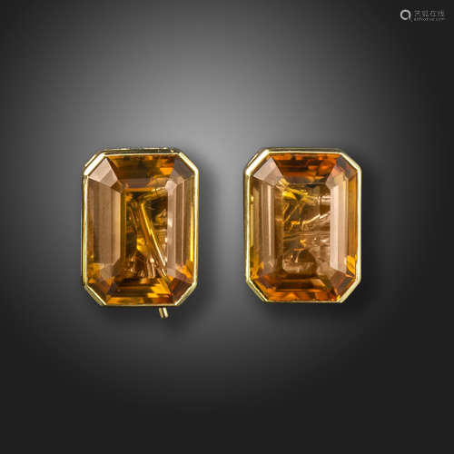 A pair of citrine-set gold earrings, the emerald-cut citrines are rubover-set in gold, folding posts