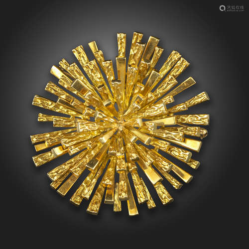 An abstract gold brooch pendant by Tiffany & Co., of sunburst design, the circular pendant with