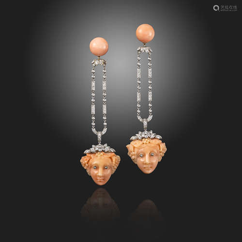 A pair of coral and diamond drop earrings, the coral cabochons suspend articulated diamond-set