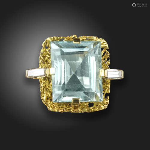 An aquamarine and diamond abstract ring, the rectangular step-cut aquamarine is set within