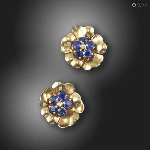 A pair of gem-set gold flower earrings by Boucheron, set with circular-cut sapphires and an old