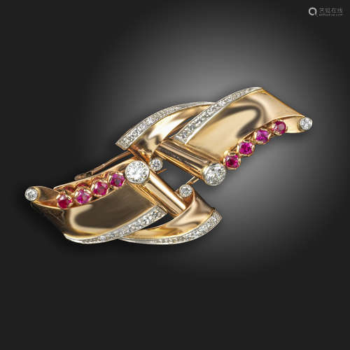 A ruby and diamond double clip brooch, c.1940, of scroll form and set with graduated circular-cut