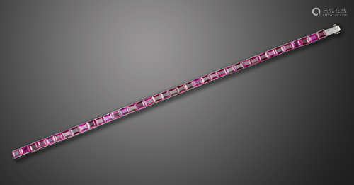 A French ruby and synthetic ruby line bracelet, channel-set with thirteen natural and twenty five