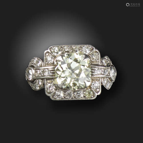 An early 20th century diamond cluster ring, centred with an old circular-cut diamond weighing