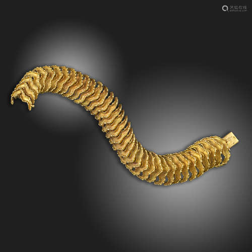 An abstract gold 'Sea Snake' bracelet by René Boivin, c.1960, designed as overlapping scales in