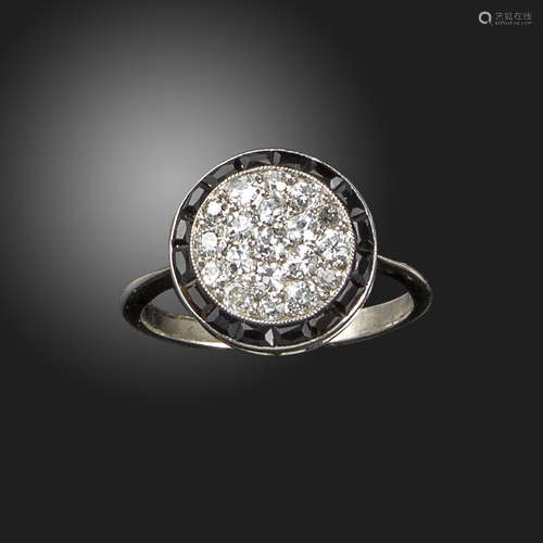 An onyx and diamond target cluster ring, signed Cartier, converted, the circular plaque pavé-set