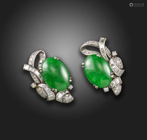 A pair of jade and diamond earrings, set with oval jadeite jade cabochons within scroll surrounds of