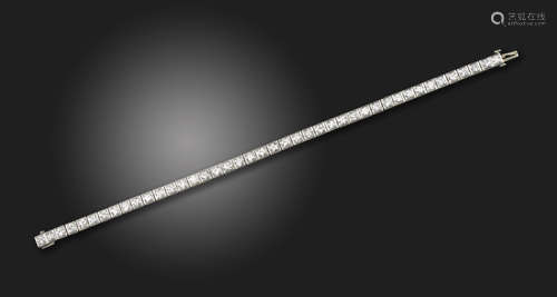 A diamond line bracelet, set with old circular-cut diamonds in square-shaped platinum mounts, with