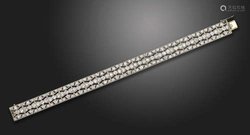 A diamond bracelet, the pierced geometric design is millegrain-set with graduated old circular-cut