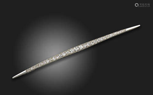 An early 20th century diamond-set hair slide, set with a line of graduated old circular-cut diamonds