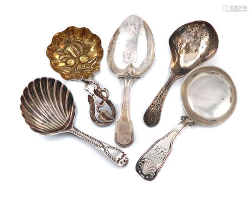 A collection of five antique silver caddy spoons, various dates and makers, including: a Victorian