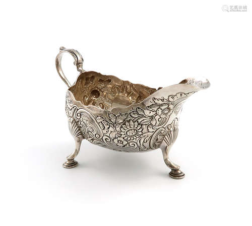 A George III Irish silver sauce boat, by William Townsend, Dublin circa 1760, oval form, embossed