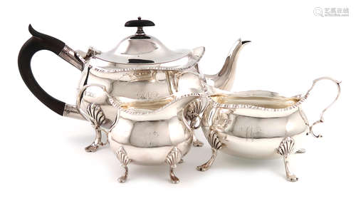 A three-piece Edwardian silver tea set, by William Hutton and Sons, London 1904/5, oval bellied