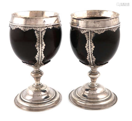 A pair of late 18th / early 19th century silver-mounted coconut cups, one with maker's mark BI