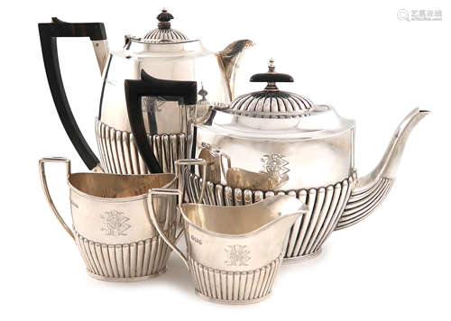 A late-Victorian matched four-piece silver tea set, by J and W Deakin, Sheffield 1892, the hot water