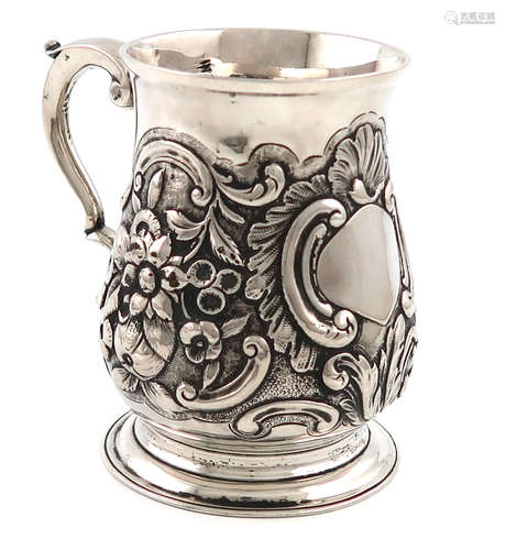 A George III silver mug, by William Grundy, London 1767, baluster form, later embossed foliate