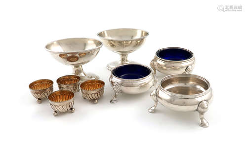 A collection of Irish silver salt cellars, comprising: a matched pair of George III salt cellars,