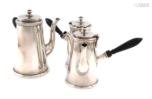 A suite of three silver cafe au lait pots, by the Harrison Brothers, London 1910/11 and Sheffield