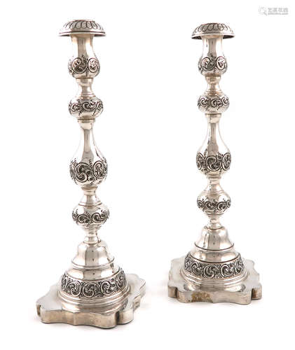 A pair of silver Sabbath candlesticks, by Sigmund Zyto, London 1921, baluster form, embossed foliate