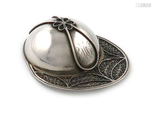 A George III novelty silver jockey cap caddy spoon, unmarked, with a filigree brim, and applied