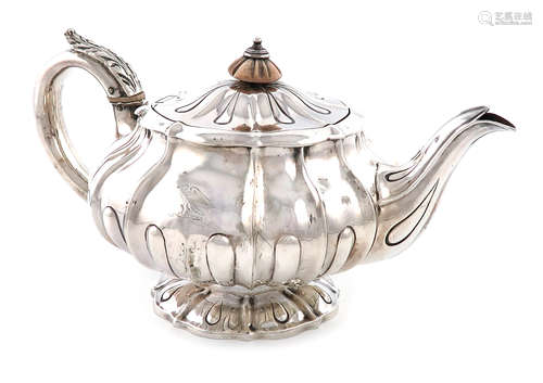 λA George IV silver teapot, by William Eley, London 1824, lobed circular bellied form, the flush