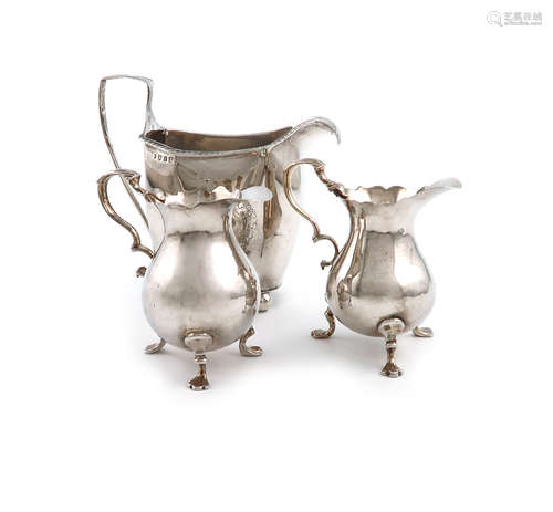 A small collection of three antique silver cream jugs, comprising: a George II one, by Richard