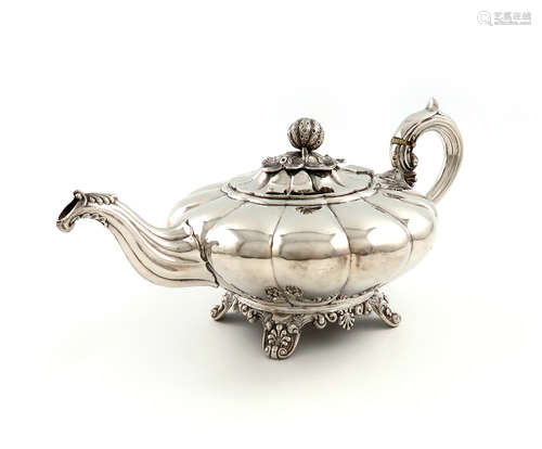 λA William IV Irish silver teapot, by James Fray, Dublin 1837, lobed circular form, scroll handle