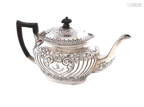 A late-Victorian silver teapot, by Jenkins & Timm, Sheffield 1897, oblong bellied form, embossed