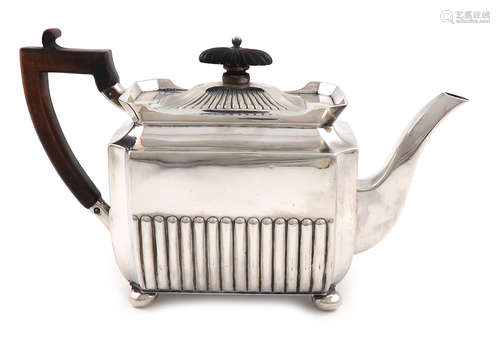 A late-Victorian silver teapot, by Gibson and Langman, London 1897, rectangular form, scroll handle,