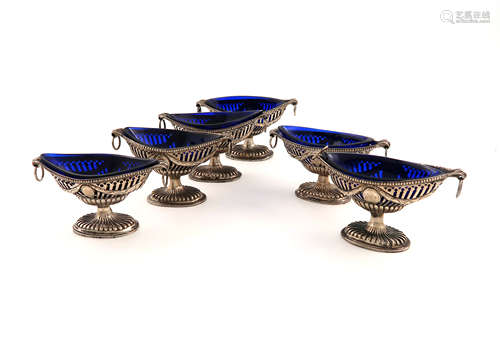 A set of six George III Irish silver salt cellars, Dublin, the majority of marks lost in piercing,