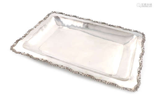 A Columbian metalware serving platter, unmarked, rectangular form, foliate scroll border, length