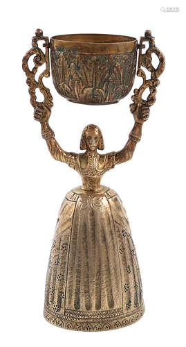 A silver-gilt wager cup, by Birch & Gaydon, London 1936, modelled as a lady with a full skirt, and