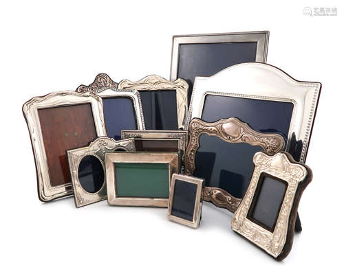 A collection of twelve silver photograph frames, various dates and makers, various shapes, some with