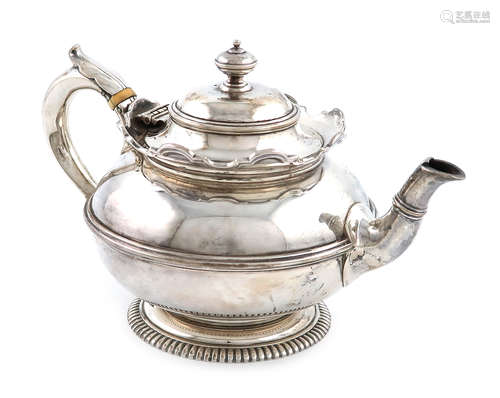 λA silver bachelor's teapot, by Sebastian Garrard, London 1926, circular form, leaf capped scroll