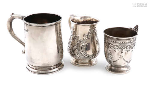 A small collection of three silver mugs, comprising: a George III one, by Thomas James, London 1809,