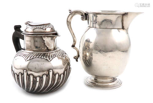 An Edwardian silver jug, by Martin, Hall and Company, Sheffield 1909, baluster form, scroll