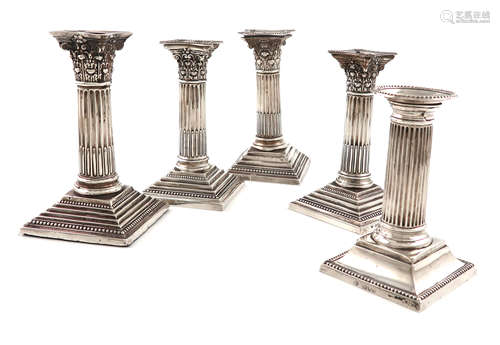 A pair of silver candlesticks, by Garrard and Co., Sheffield 1966, Corinthian column form, beaded