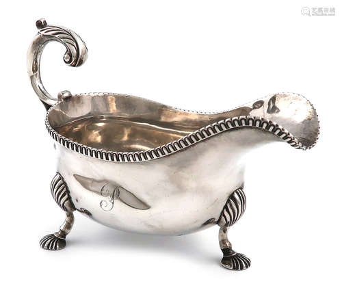 A George III silver sauce boat, possibly by William Abdy, London 1811, oval form, leaf capped scroll