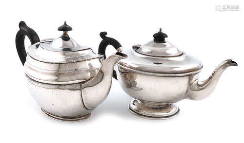 A silver teapot, by The Goldsmiths and Silversmiths Company, London 1915, oval form, scroll