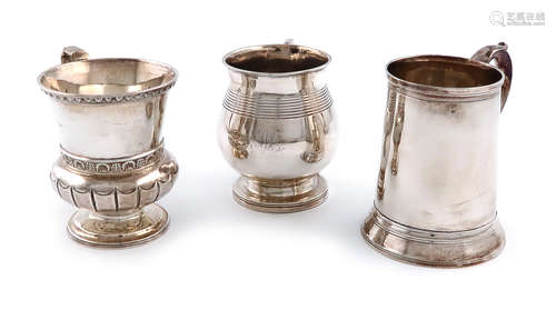 A small collection of three antique silver christening mugs, comprising: a George III provincial