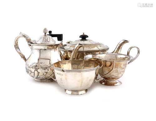 λA small collection of silver tea wares, comprising: a tea pot and sugar bowl of panelled circular